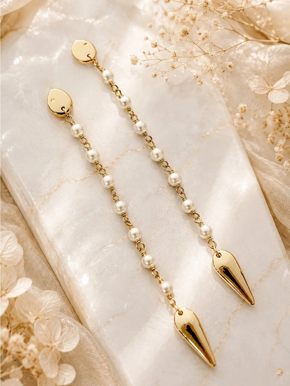 Tory Burch Snake Linear earring.